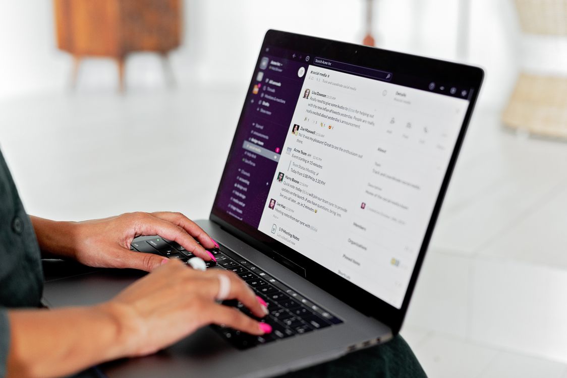 Person sending a message on a laptop